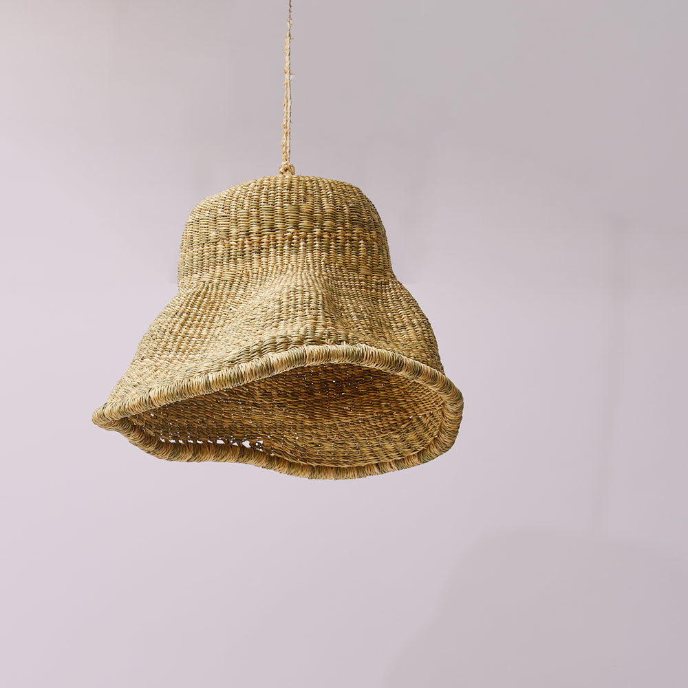 Woven Elephant Swamp Grass pendant light on a plain background