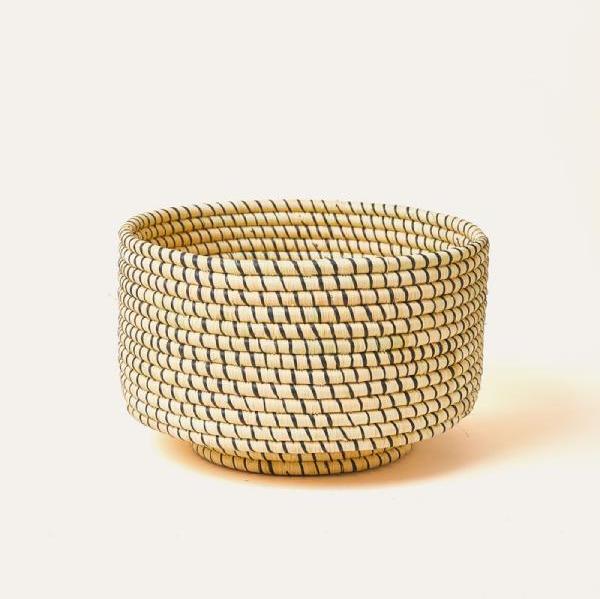 Woven basket with a textured pattern on a light background