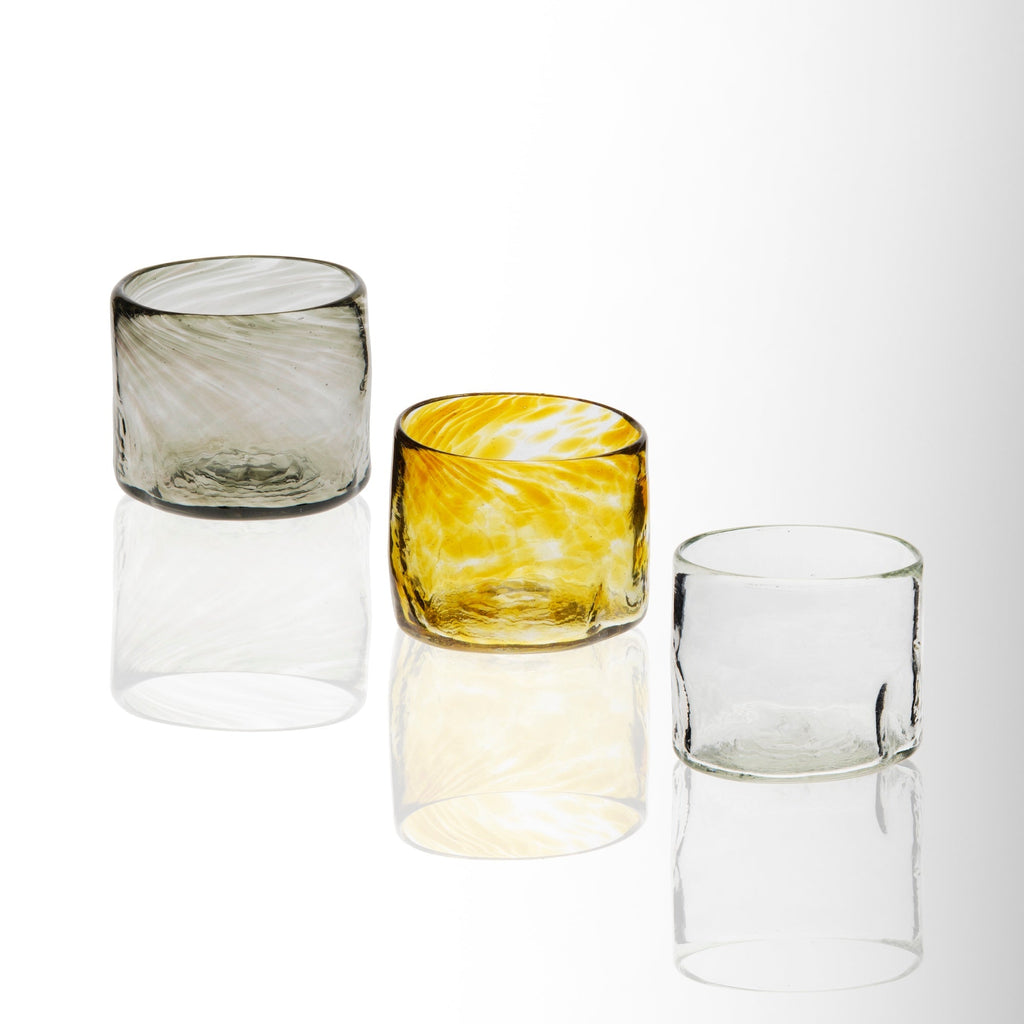 Three glass tumblers on a white background