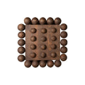 Wooden wall art piece with spherical protrusions on a white background
