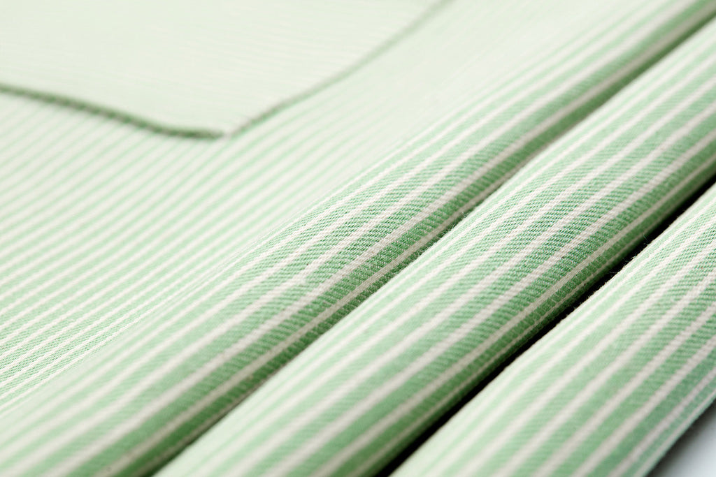 Close-up of green and white striped cloth fabric napkins 