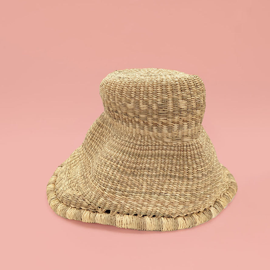 Woven Elephant Swamp Grass Light Pendant on a pink background