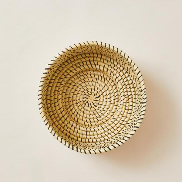 Woven basket on a light beige background