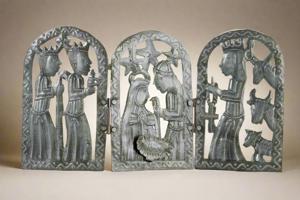 Decorative metal wall art with religious figures on a beige background
