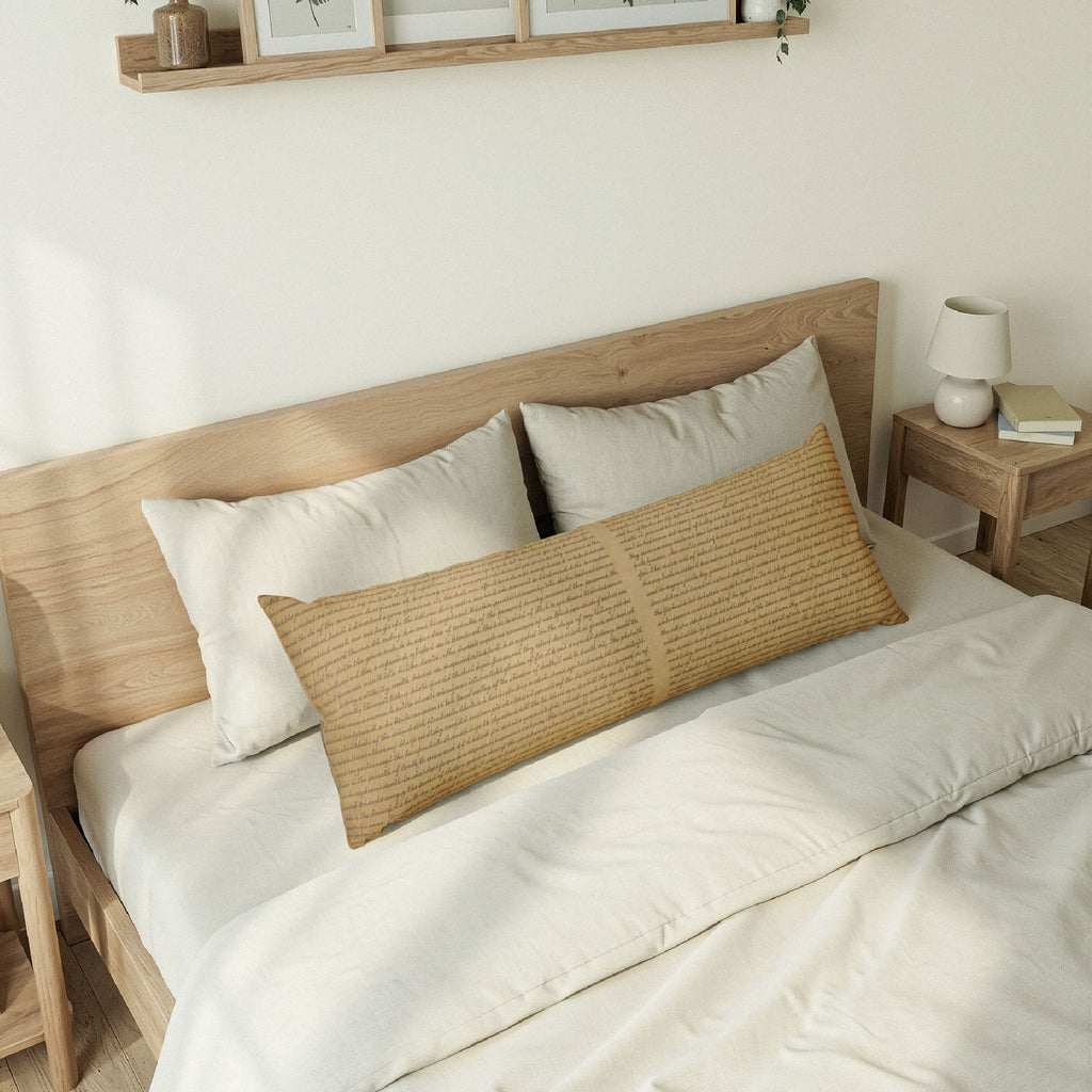 Bedroom with wooden headboard and white bedding featuring a long woven pillow.