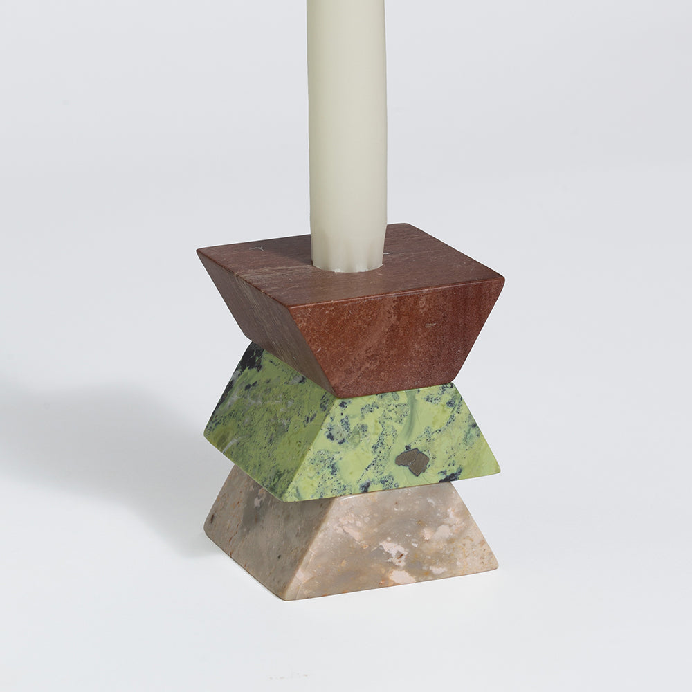 Geometric candle holder with a brown and green design on a white background