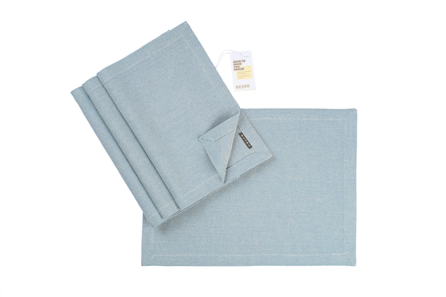 Light blue textured napkin/placemat set with a folded towel and a tag on a white background