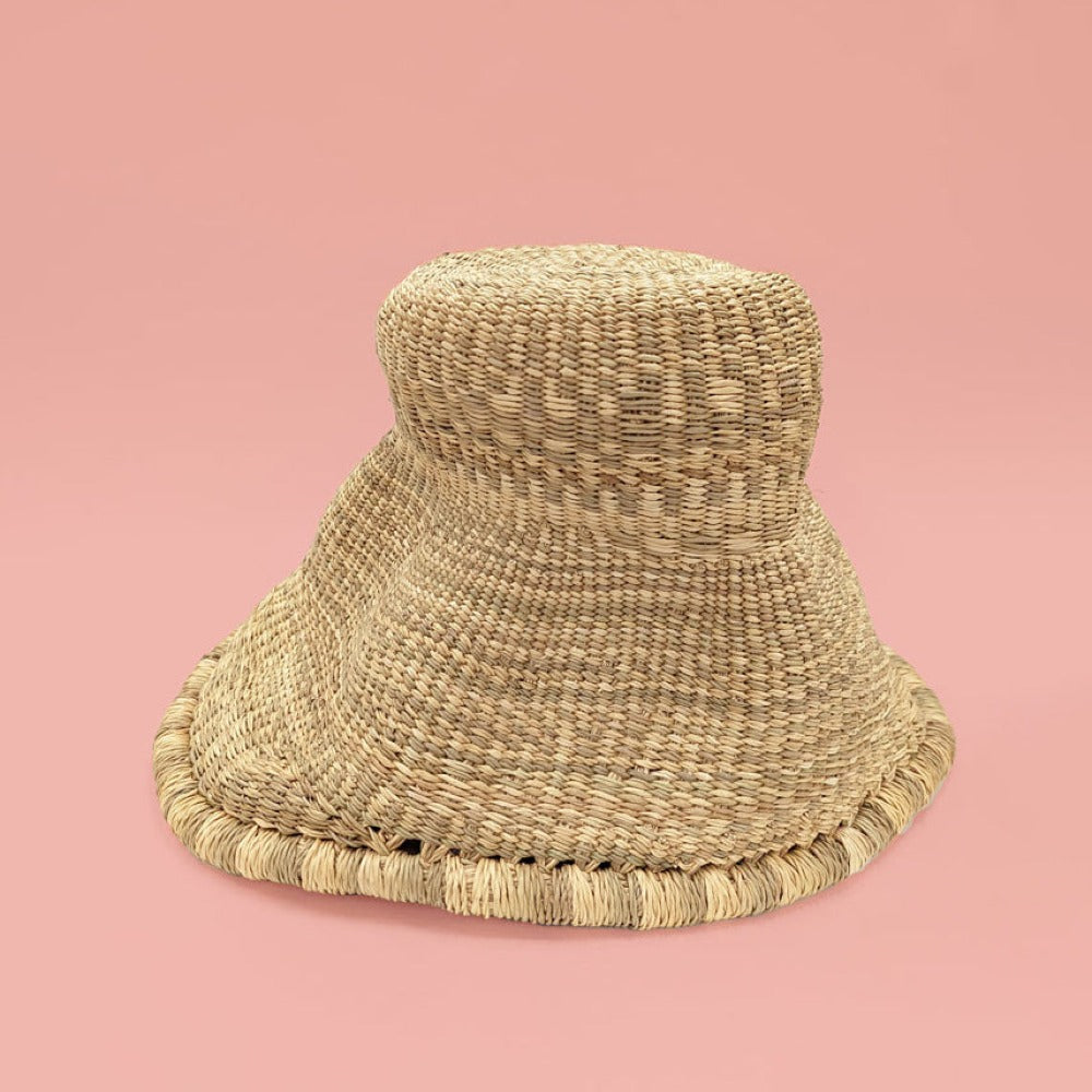 Woven sElephant Straw Grass Light Pendant on a pink background