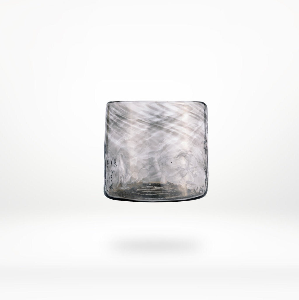 Glass with marble pattern on a white background