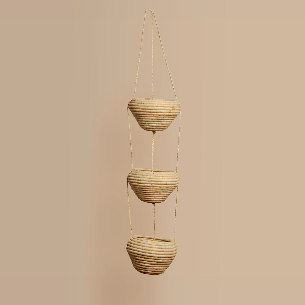3 Tiered Hanging  hand woven planters on a beige background