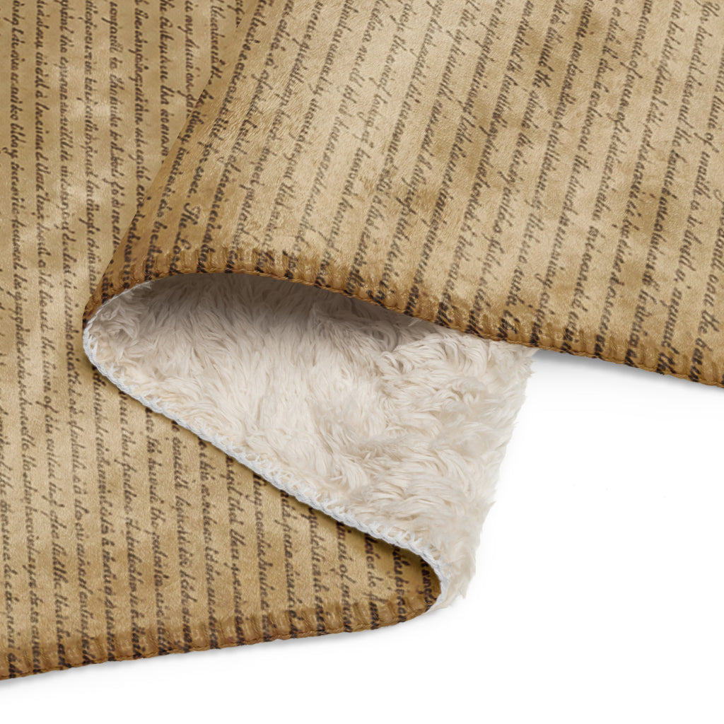 Luxury Sherpa Throw Blanket in tan color with an elegant scripted design on one side and a soft, fluffy sherpa lining on the reverse, perfect for premium home decor.